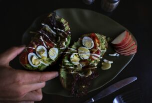 sliced bread with egg toppings on plate